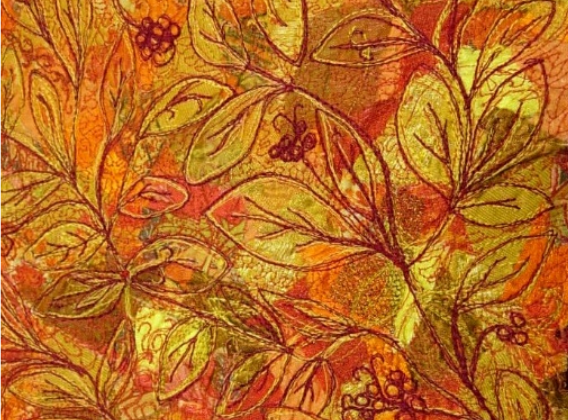 free-motion embroidery showing autumn leaves and berries