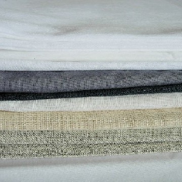 Interfacing types - various colours and types of interfacing including woven and non-woven in white, charcoal and beige colours
