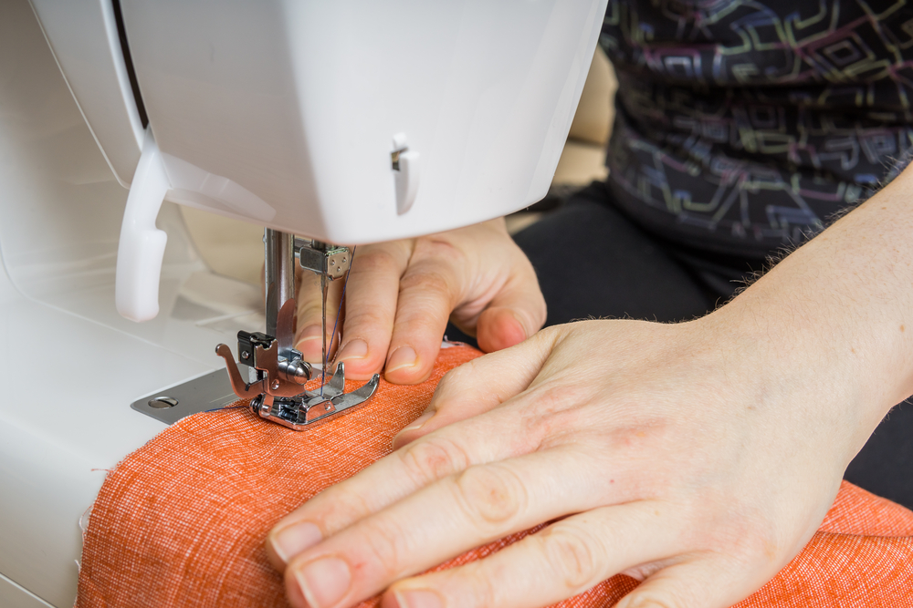 Refresher Sewing Class - a woman learning to use a sewing machine again