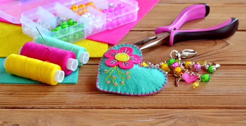 Hand embroidery. A kids sewing class to make a felt heart keychain