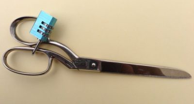 Sewing Bad Habits to avoid. Dressmaking shears with a padlock to stop them being used on substances other than fabric.