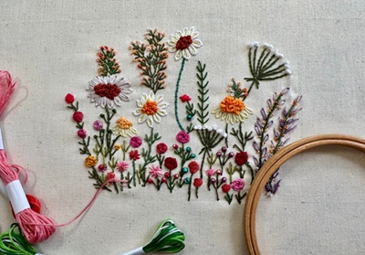 Hand embroidery stitched garden featuring six beginner stitches in vibrant floral colours, created during Artisan Stitch’s embroidery workshop.