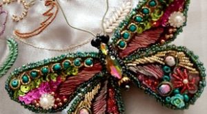 A beaded butterfly in Jewel-bright colours, stitched by the expert embroiderer Sholeh Houshangi