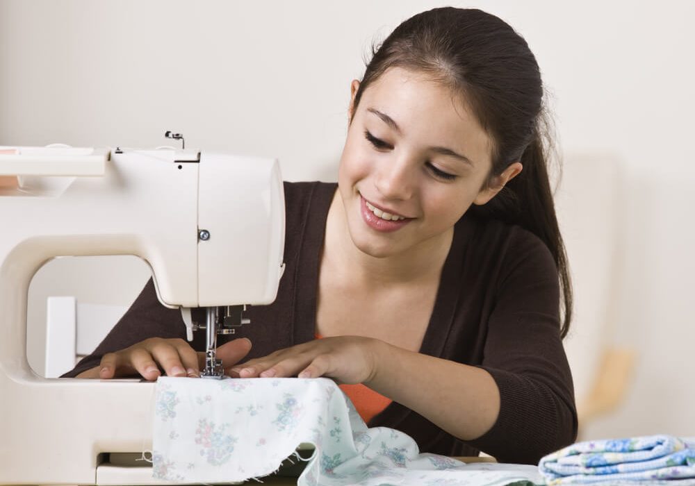 Kids Introductory Sewing Course Kids introductory sewing class - a young girl enjoying using her sewing machine