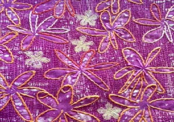 Monoprinted stitched flowers Monoprinted fabric with large daisy-like flowers which have been machine and hand embroidered